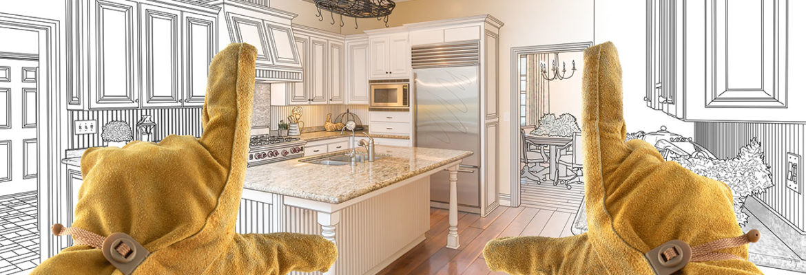 Male Contractor Hands Framing Over Custom Kitchen Design Drawing.