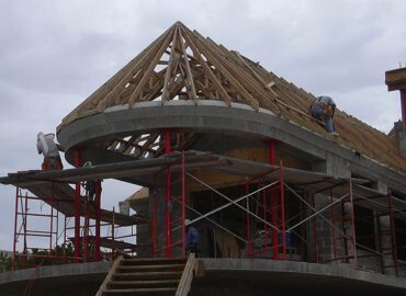 Contractors working on building a home